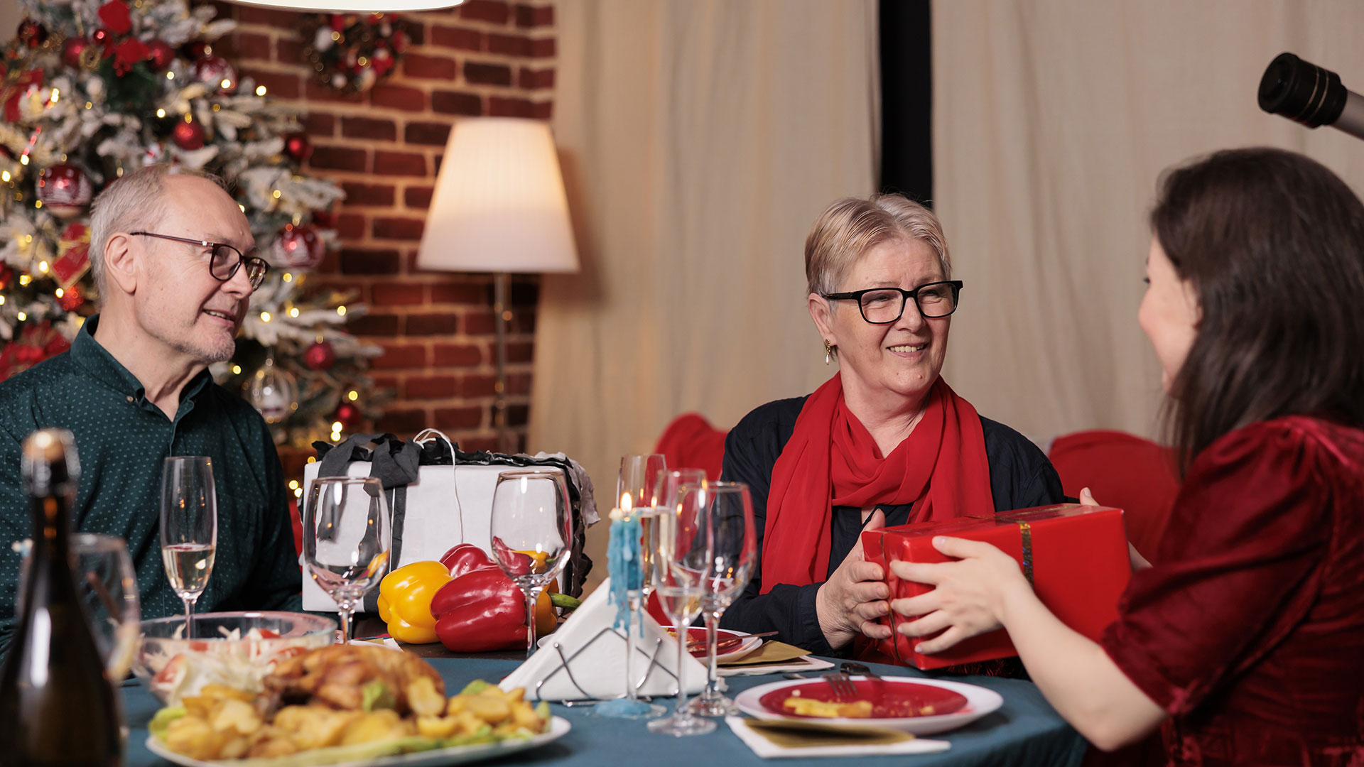 holiday party eating dinner and exchanging gifts in a clean home
