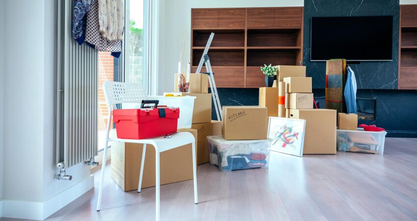 boxes piled up in clean living room after packing to move out